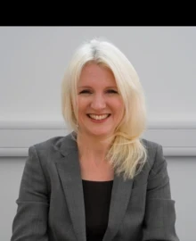 Woman in suit smiling