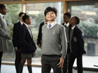 Pupil smiling to camera.