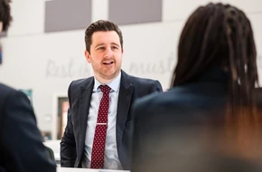 Image of Simon Renshaw looking towards an audience