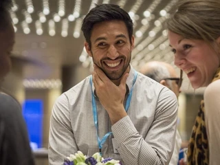 men and women laughing